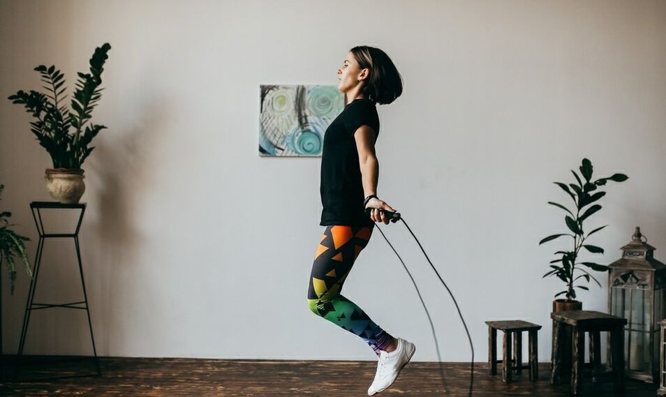 Girl does an exercise with a skipping rope