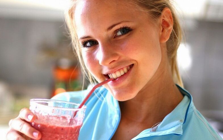 Girl drinks smoothie for weight loss