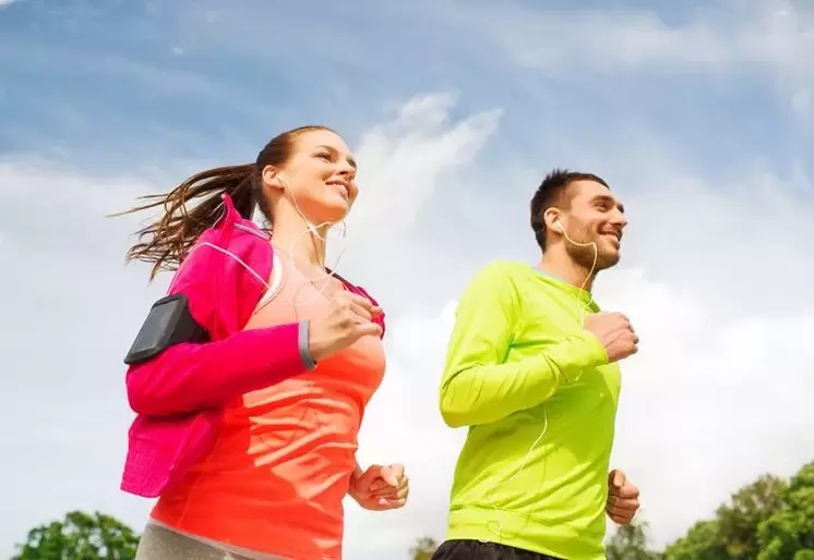 Men and women jog to be in shape