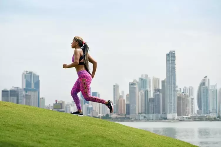 The girl adheres to the breathing rules, depending on her running technique